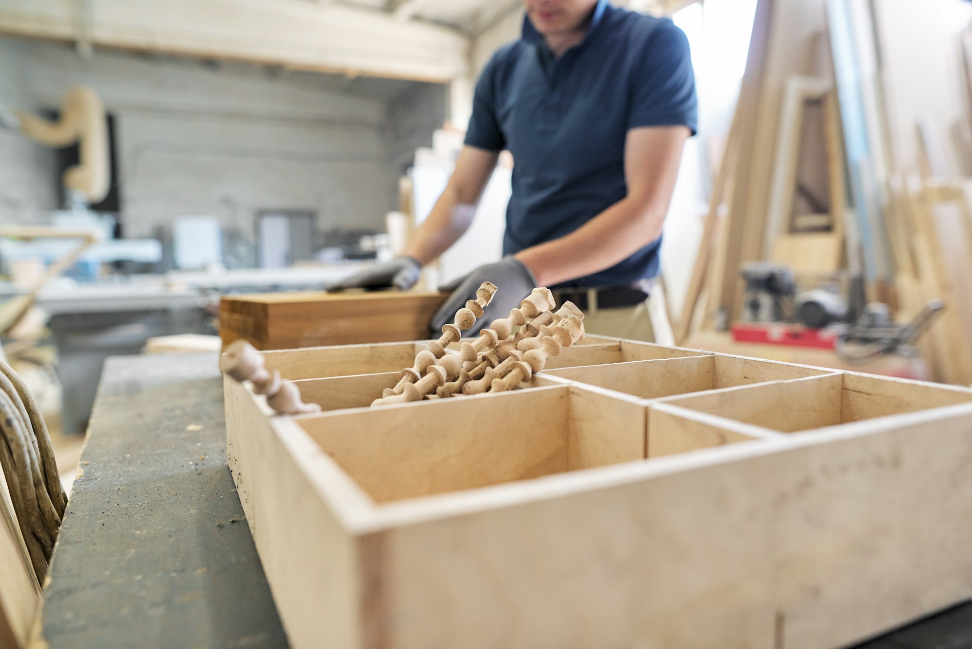 Male carpenter making wooden designer furniture for an individual private order